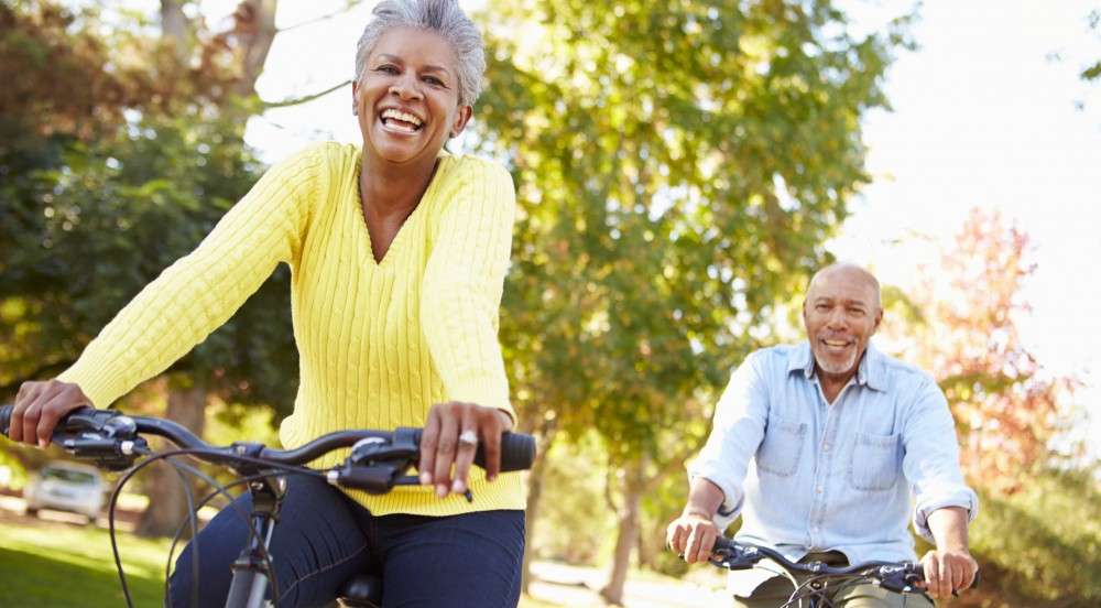 how to be heart healthy older couple riding bikes