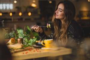 woman enjoying food intermittent fasting and working out